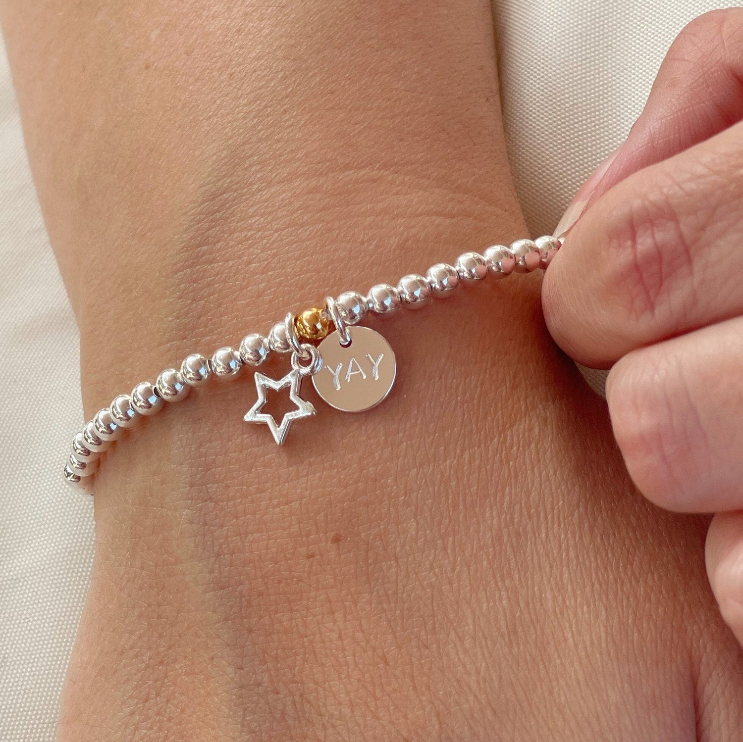 Personalised star charm bracelet with disc tag 